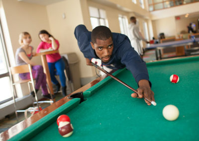 Person playing pool.