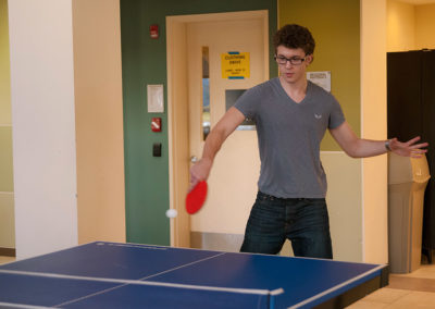 A person playing Ping Pong.