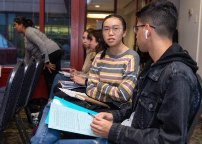 Two people sitting together having a conversation.