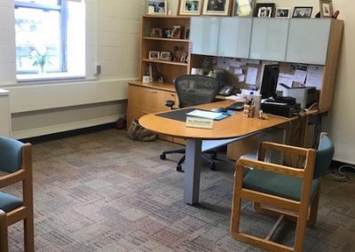 Office with an L-shaped desk.