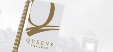 Close up of a Queens College banner on a lamppost and links to campus reopening COVID-19 guidelines.