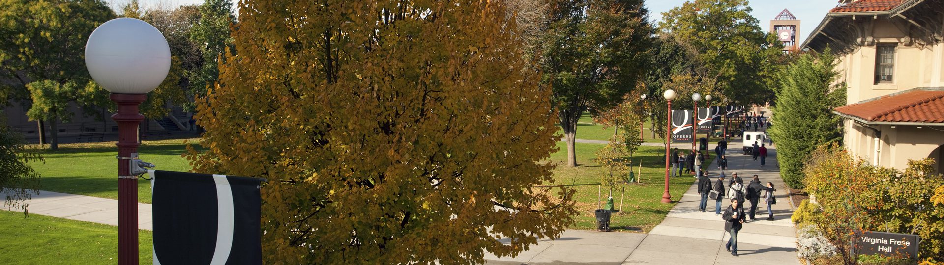 People walking through Queens College Campus.