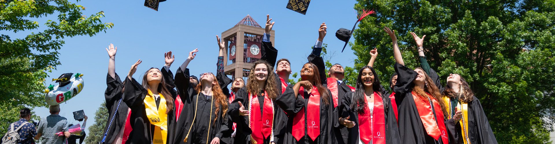 Jubilant Graduates throwing their caps in the air