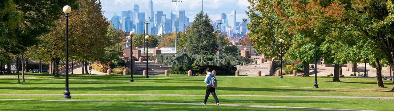 People walking through Queens College Campus.