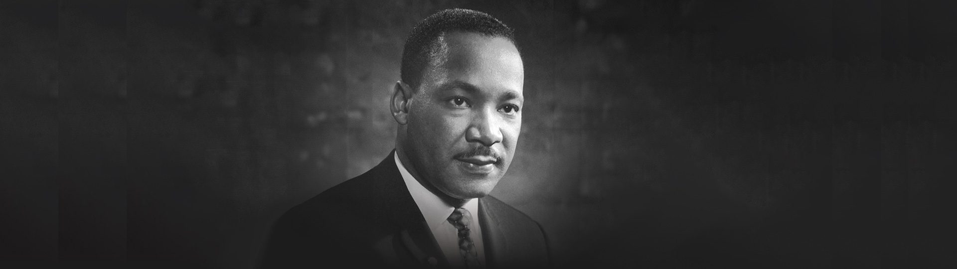 Black and White photo of Martin Luther King Wearing a Suit