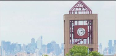 Top of Rosenthal Library with manhattan skyline in the background
